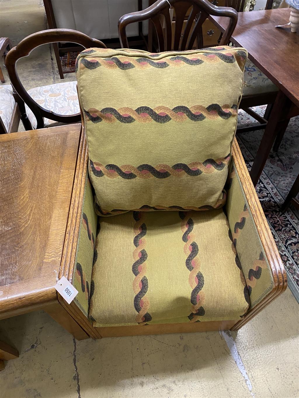 An Art Deco oak three section conversation seat, possibly with its original upholstery, width 170cm, depth 70cm, height 71cm